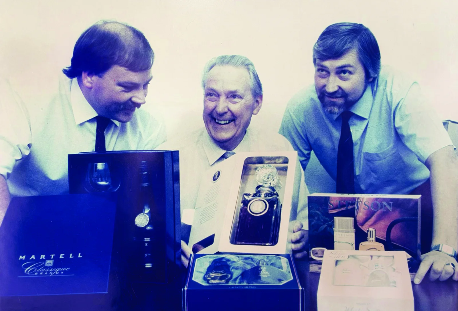 Three generations of Printafoil leadership with gift packs for Martell, Lentheric and Stetson