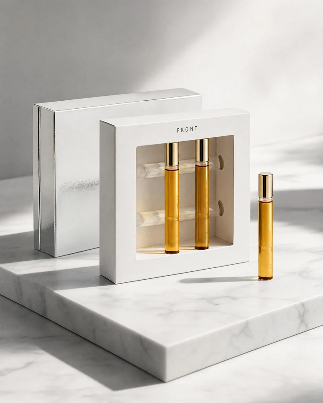 Fragrance discovery set in a white window carton on marble