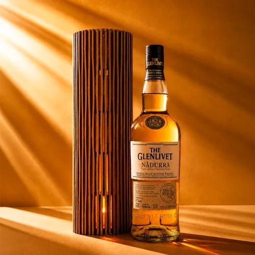 The Glenlivet Nàdurra bottle beside a slatted wooden tube